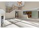 Spacious living room with fireplace, stairs, and view of the kitchen and dining area at 1818 Buxton Way, Burlington, NC 27215