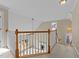 Upstairs loft featuring beautiful railing with an open view of the downstairs living area at 1818 Buxton Way, Burlington, NC 27215