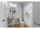 Clean and bright half bathroom with modern fixtures and a window at 1818 Buxton Way, Burlington, NC 27215