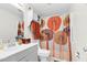 A bathroom with a gray vanity, mushroom shower curtain, toilet, and tiled floor at 198 Ridge Trl, Chapel Hill, NC 27516