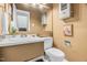 Functional bathroom featuring a white vanity, toilet, and a framed mirror and artwork at 198 Ridge Trl, Chapel Hill, NC 27516