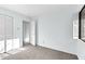 Bedroom featuring carpet, a closet with bi-fold doors, and a window with white shutter blinds at 198 Ridge Trl, Chapel Hill, NC 27516