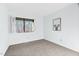 Bright bedroom with light blue walls and neutral carpet with large picture window at 198 Ridge Trl, Chapel Hill, NC 27516