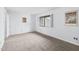 Neutral bedroom with a picture window with shutter blinds, carpet, and light blue walls at 198 Ridge Trl, Chapel Hill, NC 27516