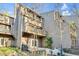 Exterior view of a multi-story home with wooden patios and a wooded yard at 198 Ridge Trl, Chapel Hill, NC 27516