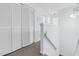 Hallway leading to the bedrooms with a ceiling fan and spacious closet at 198 Ridge Trl, Chapel Hill, NC 27516