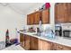 A kitchen with dark wood cabinets, white countertops, and stainless steel appliances at 198 Ridge Trl, Chapel Hill, NC 27516