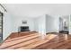Sunlit living room with hardwood floors, fireplace, and slider door to balcony at 198 Ridge Trl, Chapel Hill, NC 27516