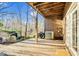 A covered patio with a wood floor and view of the backyard at 198 Ridge Trl, Chapel Hill, NC 27516