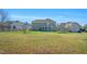 Expansive backyard with lush green grass, a screened porch, and ample space for outdoor activities at 2015 Stanchion St, Haw River, NC 27258