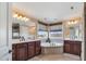 Bright bathroom with dual sink vanity, soaking tub and beautiful windows providing natural light at 2015 Stanchion St, Haw River, NC 27258