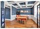 Elegant dining room with a coffered ceiling, stylish lighting, and a sophisticated ambiance at 2015 Stanchion St, Haw River, NC 27258