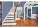 Spacious foyer with hardwood floors, a staircase, and ample natural light, creating an inviting entrance at 2015 Stanchion St, Haw River, NC 27258