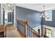 Foyer featuring a staircase, wood railing, a chandelier, and natural lighting at 2015 Stanchion St, Haw River, NC 27258