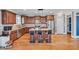 Well-appointed kitchen with granite countertops, stainless steel appliances, hardwood floors, and island seating at 2015 Stanchion St, Haw River, NC 27258