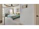 Serene primary bedroom featuring tray ceiling, with ample natural light, plush carpeting, and a relaxing atmosphere at 2015 Stanchion St, Haw River, NC 27258