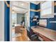 Bright office space with hardwood floors, custom built-ins, and ample natural light, perfect for a productive work environment at 2015 Stanchion St, Haw River, NC 27258
