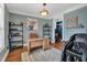 Comfortable home office with natural light, shelving, hardwood floors and plenty of room to work and relax at 2015 Stanchion St, Haw River, NC 27258