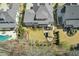 An overhead view of the home, showing the landscaped yard, patio, and surrounding neighborhood at 2046 Fellini Dr, Apex, NC 27502