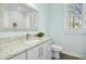 Bright bathroom with a granite vanity, modern fixtures, a large mirror, and tile floors at 2046 Fellini Dr, Apex, NC 27502