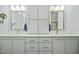 Well-lit bathroom featuring double sinks, ample counter space, and stylish cabinets at 2046 Fellini Dr, Apex, NC 27502