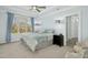 Bright bedroom boasting a large window, ceiling fan, and soft color palette at 2046 Fellini Dr, Apex, NC 27502