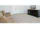Finished basement bonus room with comfortable seating and entertainment center, perfect for movie nights at 2046 Fellini Dr, Apex, NC 27502