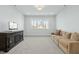 Large bonus room featuring a large sofa and an entertainment unit perfect for relaxing and media at 2046 Fellini Dr, Apex, NC 27502