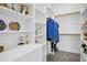 Organized walk-in closet featuring custom shelving and storage solutions at 2046 Fellini Dr, Apex, NC 27502
