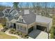 Charming brick home with a three-car garage, landscaped yard, and classic architectural details at 2046 Fellini Dr, Apex, NC 27502