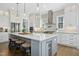 Gourmet kitchen featuring a large center island with seating and stainless steel appliances at 2046 Fellini Dr, Apex, NC 27502