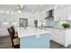 Beautiful kitchen island with white countertops, stainless steel appliances, and pendant lighting at 2046 Fellini Dr, Apex, NC 27502