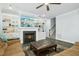Cozy living room boasts a fireplace with built-in bookshelves and plush seating at 2046 Fellini Dr, Apex, NC 27502