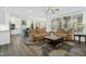 Spacious open-concept living area with modern kitchen and cozy seating arrangement at 2046 Fellini Dr, Apex, NC 27502