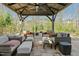 Gazebo area with comfortable seating around a paved patio at 2046 Fellini Dr, Apex, NC 27502