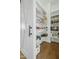Well-organized pantry with ample shelving for storing food and supplies, enhancing kitchen efficiency at 2046 Fellini Dr, Apex, NC 27502
