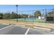 Outdoor community tennis court with full fencing, adjacent to parking at 2046 Fellini Dr, Apex, NC 27502