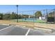 Community tennis court is fenced with lighting and has a parking area for residents' convenience at 2046 Fellini Dr, Apex, NC 27502