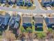 An aerial view showcasing neighborhood homes with decks and a community wooded area at 205 Virginia Water Dr, Rolesville, NC 27571