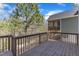 Wooden back deck offering a serene view of the surrounding trees and landscape at 205 Virginia Water Dr, Rolesville, NC 27571