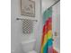 Bathroom featuring a rainbow shower curtain next to a toilet at 205 Virginia Water Dr, Rolesville, NC 27571