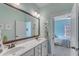 Bathroom vanity with double sinks and a view into the pastel blue bedroom at 205 Virginia Water Dr, Rolesville, NC 27571