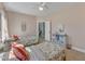 Comfortable bedroom features two twin beds with soft pillows and colorful linens in a neutral color palette at 205 Virginia Water Dr, Rolesville, NC 27571