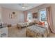 Bright bedroom featuring twin beds, natural light, and charming decor at 205 Virginia Water Dr, Rolesville, NC 27571