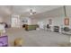 Large bonus room featuring flexible spaces for entertainment and study, bathed in natural light at 205 Virginia Water Dr, Rolesville, NC 27571