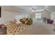 Spacious bonus room with vaulted ceilings, comfortable seating area, and versatile play space at 205 Virginia Water Dr, Rolesville, NC 27571