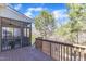 Wide wooden deck with railings and a screened porch, blending indoor and outdoor living at 205 Virginia Water Dr, Rolesville, NC 27571
