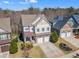 Charming two-story home with a manicured lawn and a two-car garage at 205 Virginia Water Dr, Rolesville, NC 27571