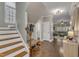 Entryway features hardwood floors, a staircase, and a glimpse into the inviting living spaces at 205 Virginia Water Dr, Rolesville, NC 27571
