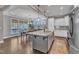 Bright kitchen with stainless steel appliances, a large island, and adjacent dining area at 205 Virginia Water Dr, Rolesville, NC 27571